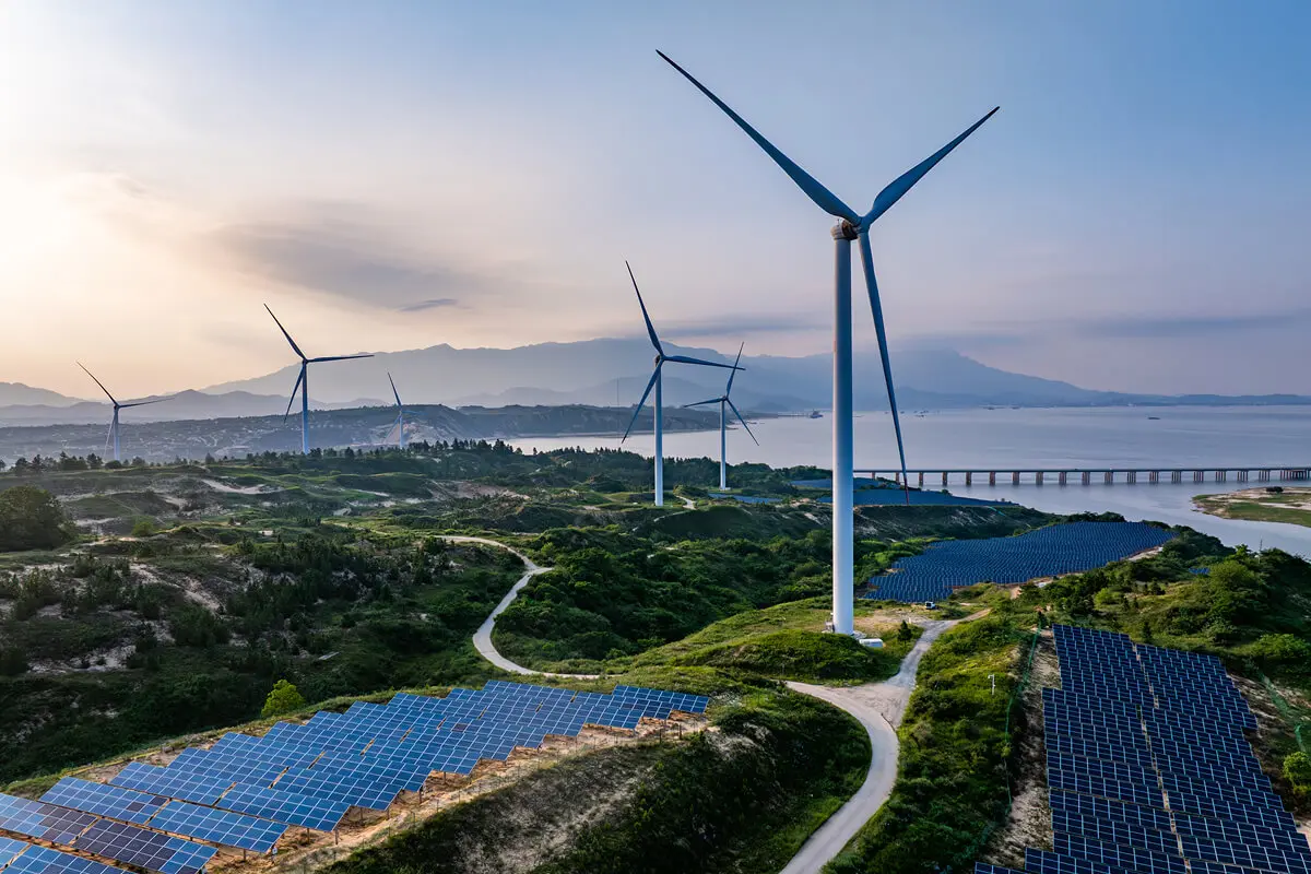 Wind turbines and solar panels by ocean