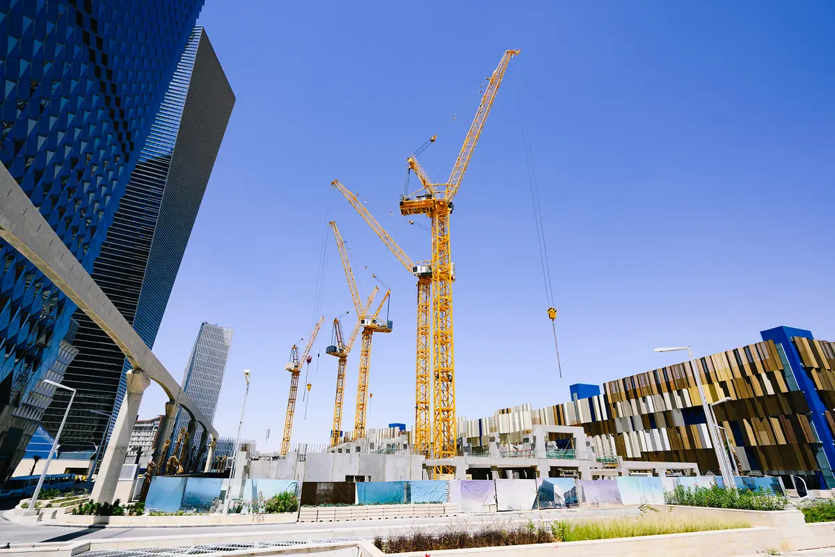 New city development with cranes and buildings.