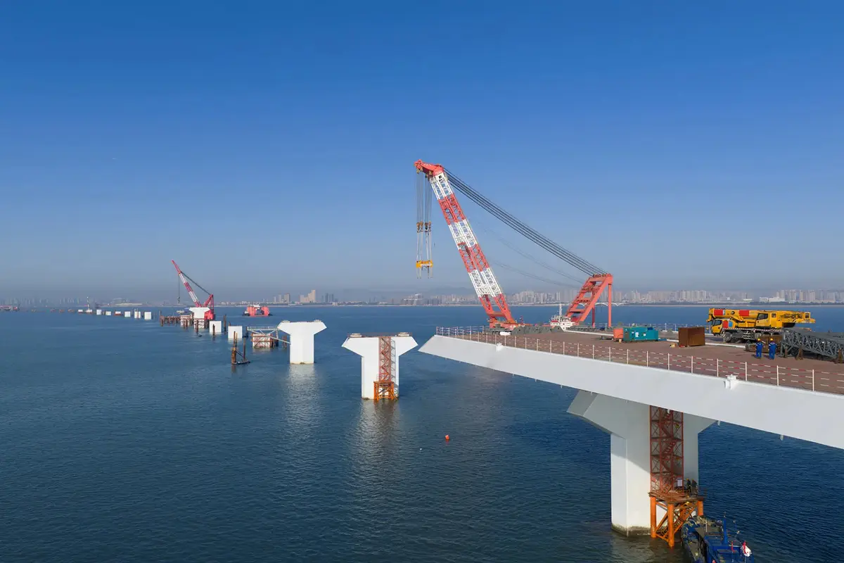 Cranes building a bridge