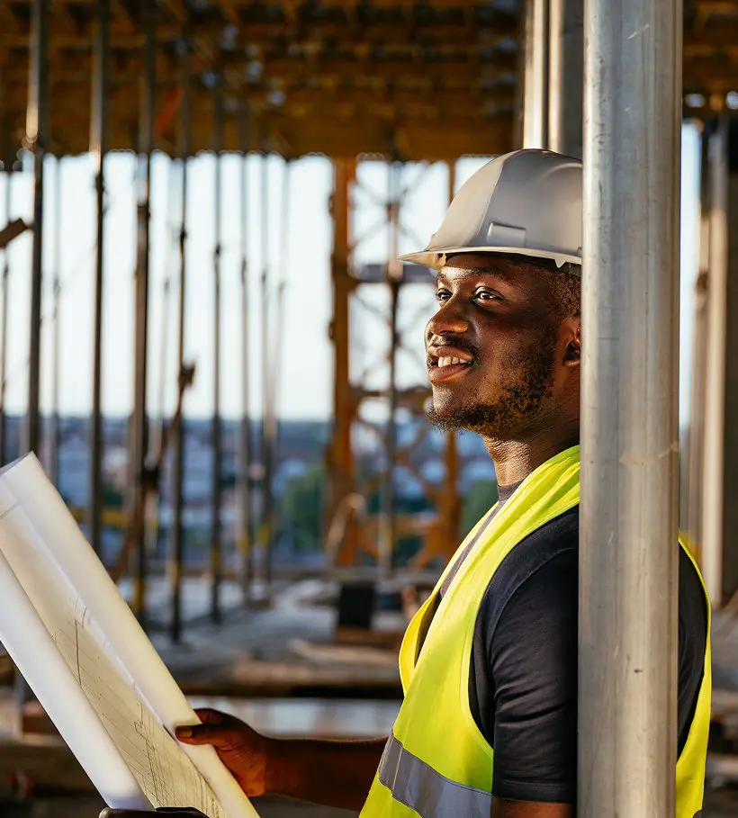 Engineer on job site with hard hat